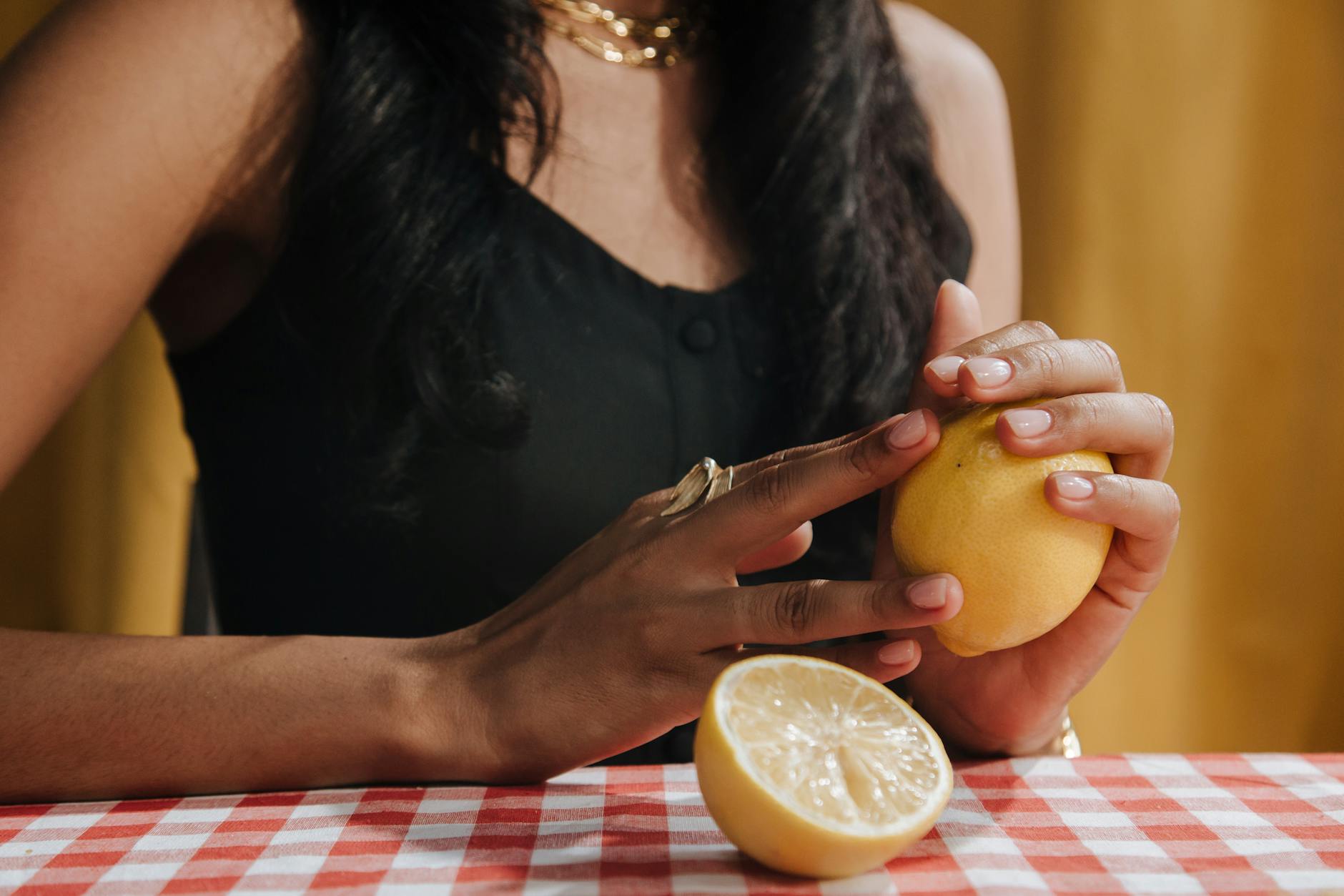 Fresh yellow lemons on a soft pastel background, symbolizing newness and exploration